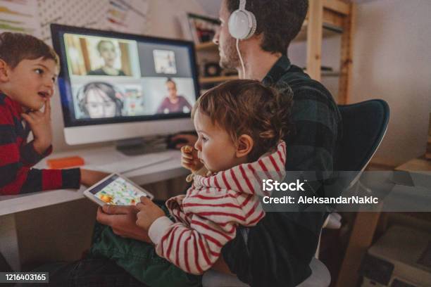 Having A Video Conference Call From Home Stock Photo - Download Image Now - Working At Home, Child, Family
