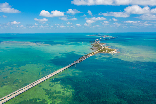 Drone point of view shot of a bridge and islands in the sea under a blue sunny sky, Key West, Florida, USA