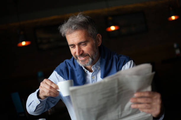 istock Senior man with newspaper 1216405286