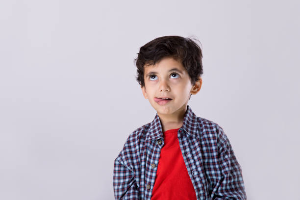 istock Boy licking his lips with tongue 1216409406