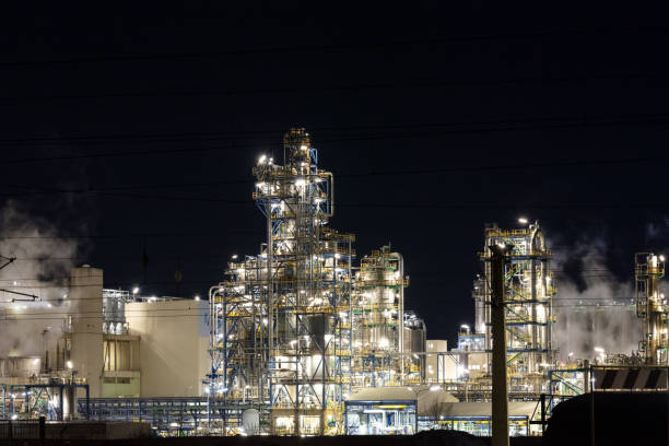 istock Oil refinery at night industry. 1216409736