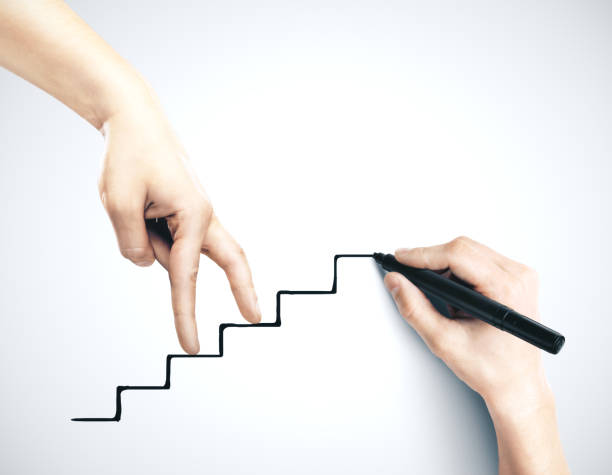 istock Hand climbing on drawing stairs. 1216409815