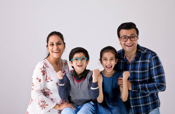 istock Portrait Indian family over white background 1216410922