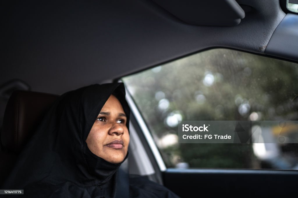 Arab Middle East woman driving a car One Woman Only Stock Photo