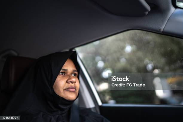 Arab Middle East Woman Driving A Car Stock Photo - Download Image Now - One Woman Only, 30-34 Years, Abaya - Clothing