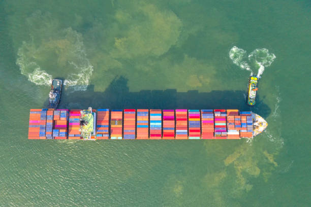 istock Container , container ship in export and import business and logistics. Shipping cargo to harbor by crane. Water transport International. Aerial view and top view. 1216413369