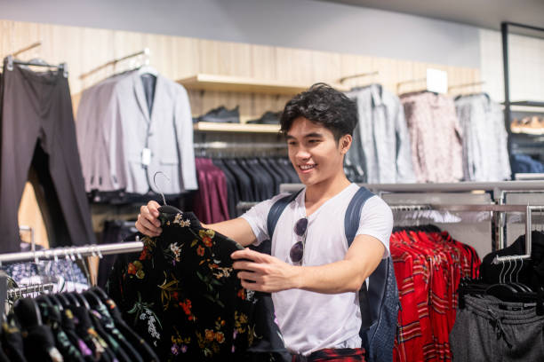 istock Young millennial male shopping 1216413488
