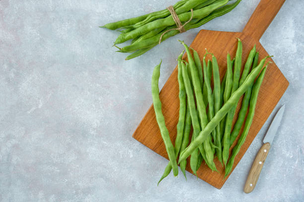 istock Green common bean  on wooden  board  .Top view with copy space 1216418356
