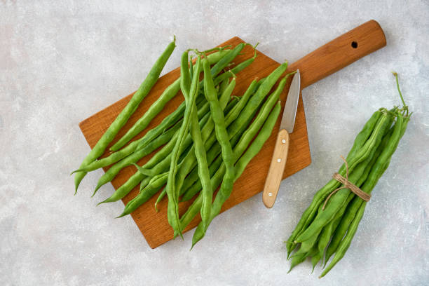 istock Green common bean  on wooden  board  .Top view with copy space 1216418445