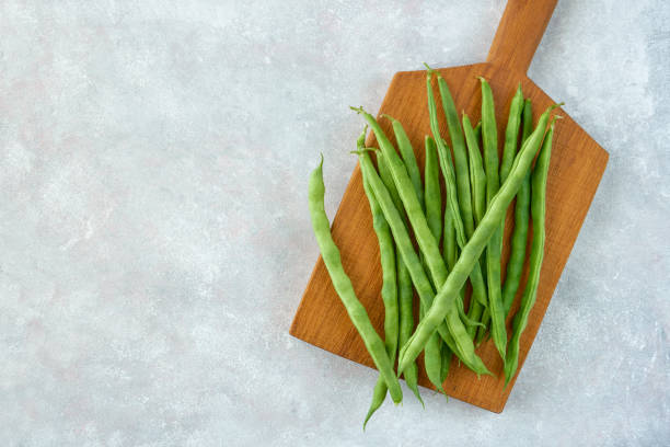 istock Green common bean  on wooden  board  .Top view with copy space 1216418484