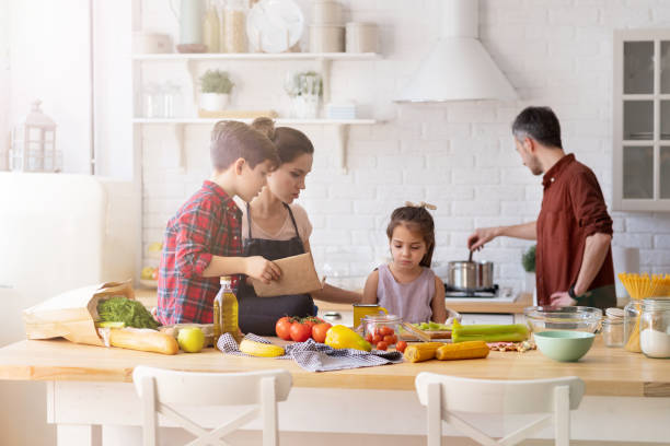 istock Family with kid spending time on home kitchen 1216418545
