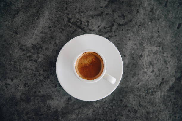 istock hot espresso coffee simple shot top view 1216419569