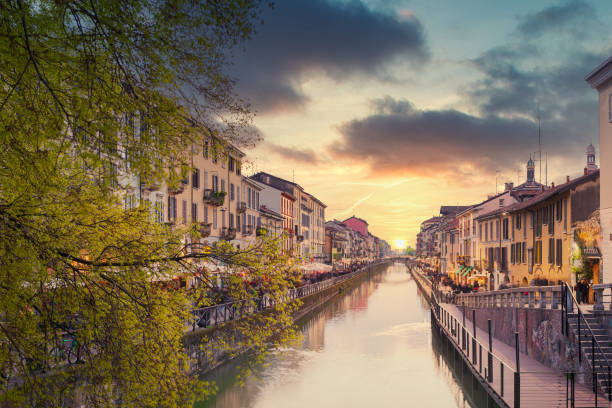 Naviglio Grande canal at sunset Naviglio Grande canal at sunset,on the sides of the canal the typical bars, restaurants and typical shops of the "Milanese Movida",Lombardy Italy. lombardy photos stock pictures, royalty-free photos & images