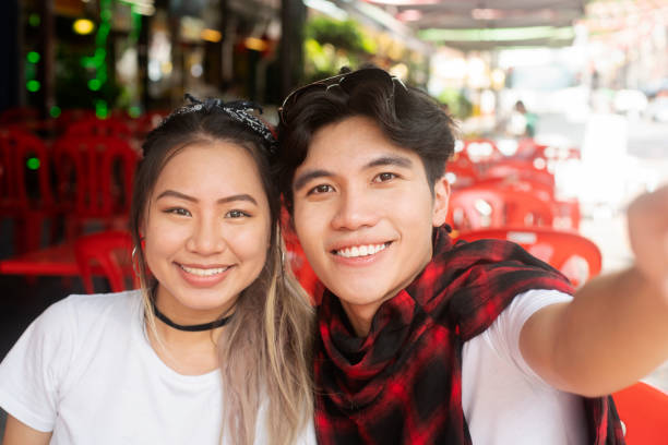 istock Young couple taking selfie 1216421610