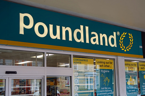 Entrance to Poundland supermarket on the High Street. Showing logo and branding. Spring day. Billericay, Essex, United Kingdom, April 2, 2020