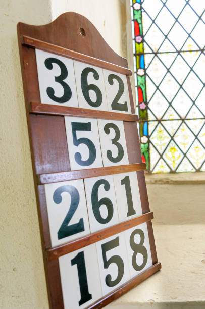 hymn board set against a window in a church of england. - church stained glass hymnal glass imagens e fotografias de stock