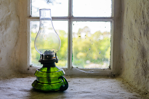 Oil lamp on the windowsill of an Irish farmhouse