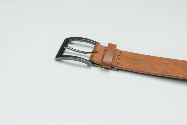 istock Leather brown belt on a white background 1216423925