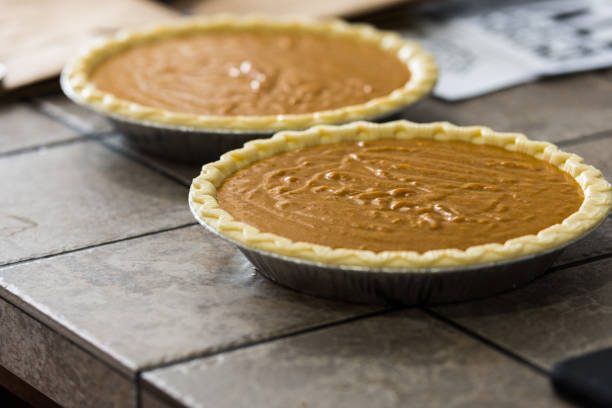 istock Homemade pumpkin pies ready to bake 1216424947