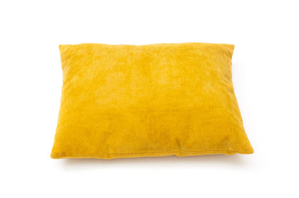 istock Yellow cushion close up on white background 1216425000