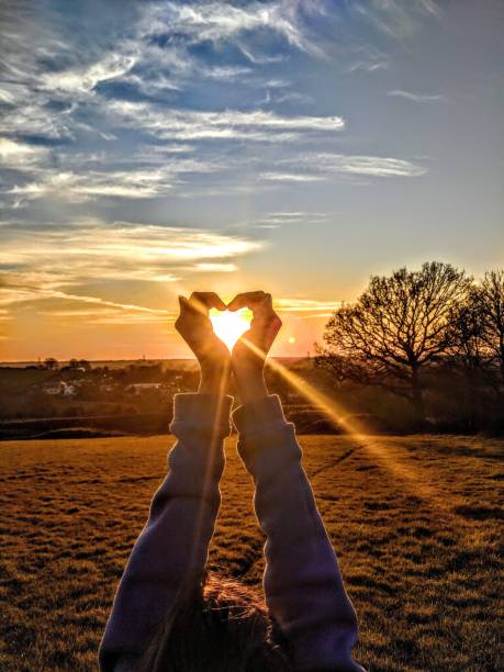 Heart and Soul Capturing the sun with love spirituality stock pictures, royalty-free photos & images