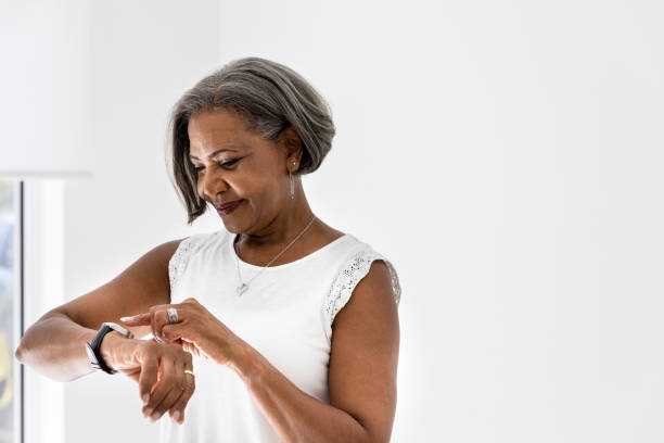 istock African American woman checking time on watch 1216426239