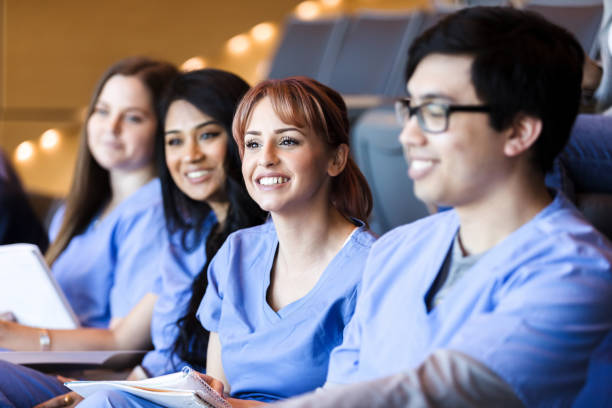 istock Group of college friends sit together for science lecture 1216426370