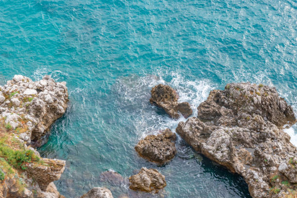 istock Splashing wave on the shore, Amalfi coast, Italy 1216426587