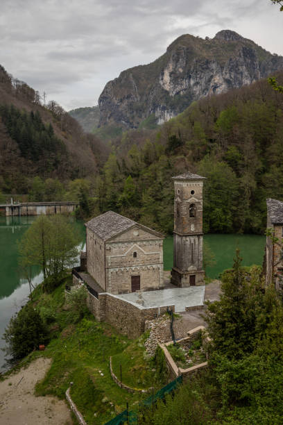Small church at a pond between Toscany hills stock photo