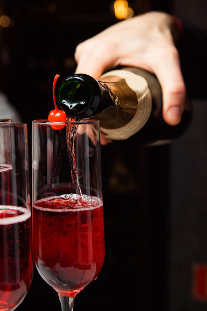 istock The waiter pours champagne 1216426981