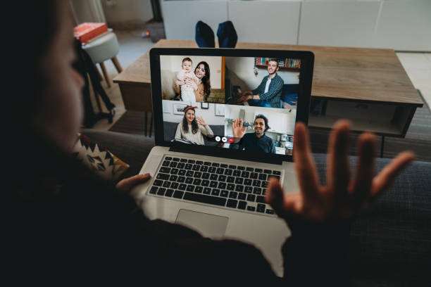 istock Young woman using a laptop to connect with her friends and parents during quarantine 1216427202