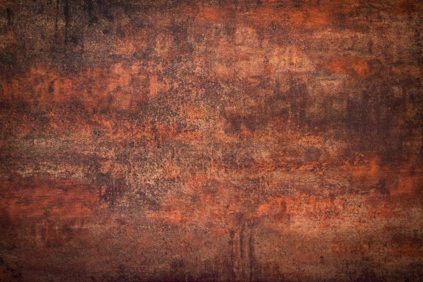 Rusty wall - grunge background Close-up of an rusty distressed dark wall. Aging process concept. rust germany stock pictures, royalty-free photos & images