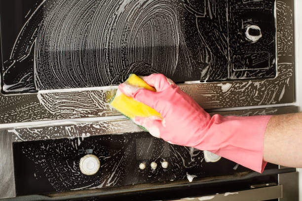 istock Man with rubber gloves cleaning 1216428408