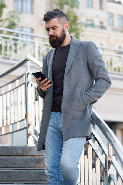 istock Social networks dependence. Busy man use mobile phone outdoors. Social media time tracker provide detailed information how many times day pick smartphone. Limit social media usage. Addicted concept 1216428612