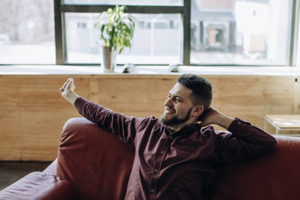 istock Young bearded man resting at home 1216430170