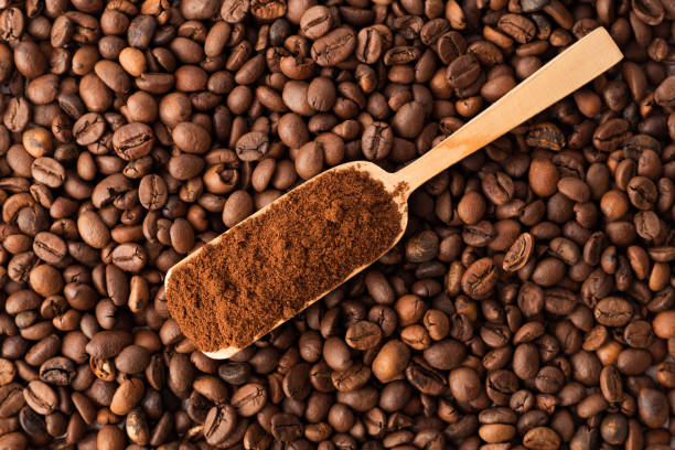 istock Fresh coffee beans and ground coffee, close-up, top view 1216431205
