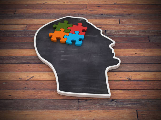 istock Human Head Shape with Puzzle on Wood Floor - 3D Rendering 1216432013