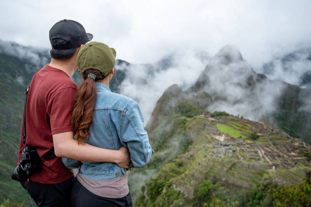 istock Asian couple tourist looking at Machu Picchu 1216432092