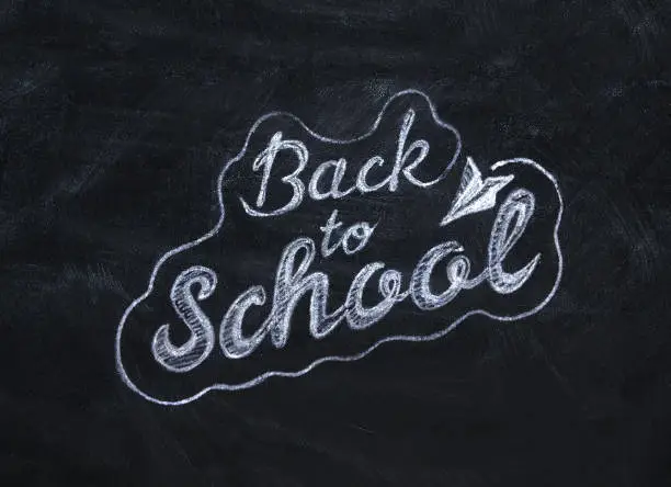 Photo of Blackboard with back to school inscription chalk on there, 3D illustration