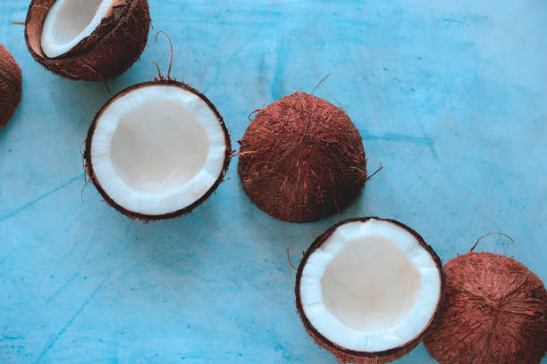 istock coconut halves  on a blue background 1216433500