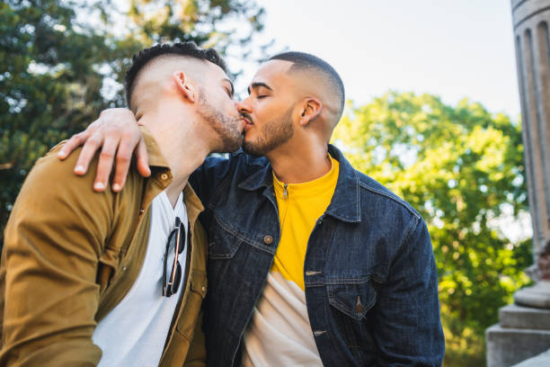 istock Gay couple spending time together at the park. 1216433643
