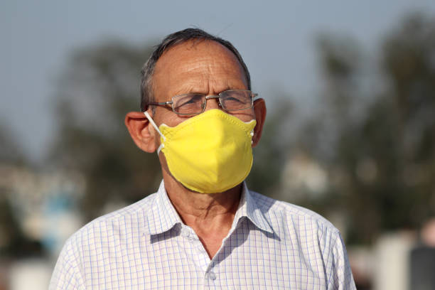 istock Senior men covering his face with pollution mask for protection from viruses 1216433847