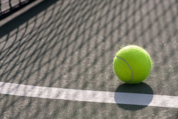 istock Tennis Ball on the Court Horizontal 1216435497