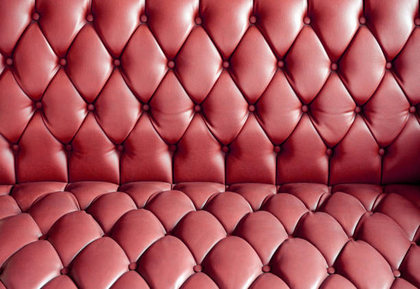 istock Vintage leather sofa buttoned of textured background 1216436180