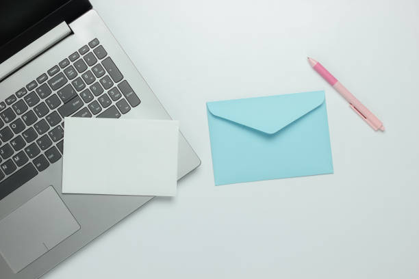 istock Laptop and envelope with letter on white background. Valentine's day. Top view 1216436535