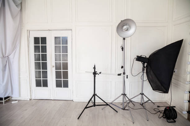 istock white photo studio interior with flashes and racks 1216437645