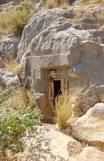 Mysterious cave entrance stock photo