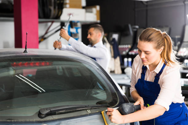 istock Woman mechanic sanding automobile body 1216441233