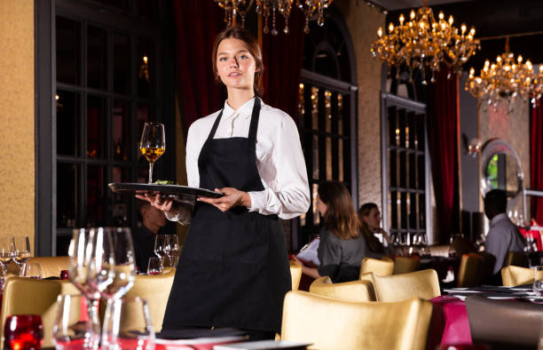 istock Waitress holding tray with dish 1216442675