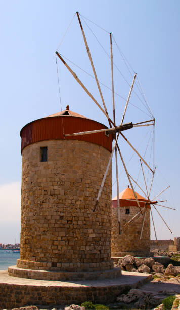 istock Windmills in Mandraki harbour, Rhodes, Greece 1216443299